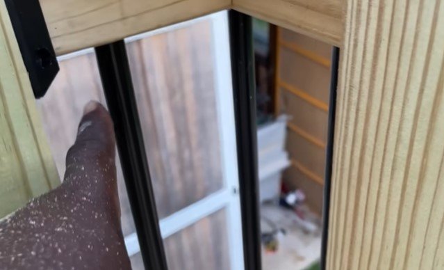 railing post rebuilt and secured at the base